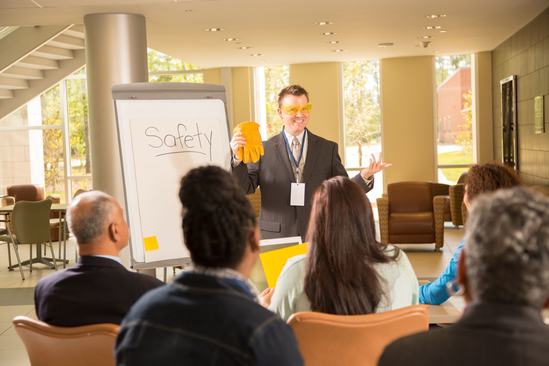 Safety in the workplace. Presentation with office workers.